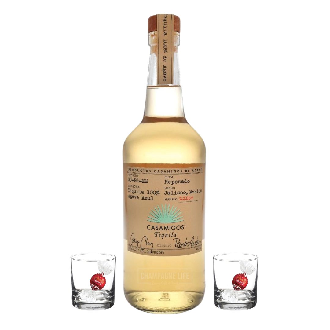 Casamigos Reposado with two shot glasses and chocolate truffles